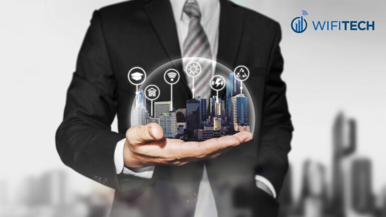man in business suit holding city scape in hand with technology icons